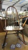 A stick back rocking chair.