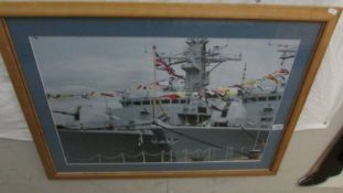 A large framed and glazed image of a battle ship, 94 x 68 cm.