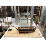 A cased model galleon.