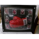 A framed signed boxing glove 'Iron' Mike Tyson with certificate of authentication.