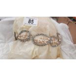 A circa 1950's pearl set wedding tiara with long veil.