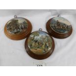 3 framed Pratt ware pot lids 'The Village Wedding Teniers Pinx' and 2 rural scenes.