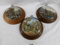 3 framed Pratt ware pot lids 'The Village Wedding Teniers Pinx' and 2 rural scenes.