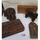 A Black forest wall bracket, a carved wood box, a wooden cannon, a hand painted icon,