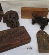 A Black forest wall bracket, a carved wood box, a wooden cannon, a hand painted icon,