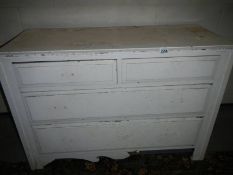 A painted 2 over 2 chest of drawers.