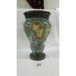 A Doulton Lambeth 26 cm vase decorated with birds, butterflies,