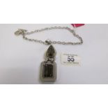A quality smoky quartz heavy silver pendant and chain with attached heart charm.