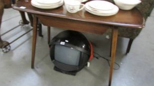 A dark oak Ercol style table.