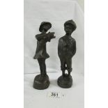 A pair of French boy/girl bronze figures, 9".