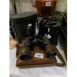 A cased pair of Prinzlux binoculars and one other.