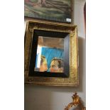 A late 19th / early 20th century gilt framed mirror.