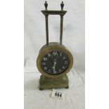 A Victorian brass gravity clock in working order.