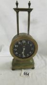 A Victorian brass gravity clock in working order.