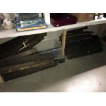 A large quantity of 'O' gauge model railway track on wooden sleepers and board.