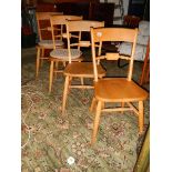 A set of 4 pine kitchen chairs.