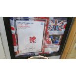 A framed and glazed Olympic Games 2012 programme/Anthony Joshua montage, signed.