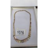 A cased 9ct gold necklace, 25.5 grams. ****Condition report**** Clasp Hallmarked.