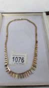 A cased 9ct gold necklace, 25.5 grams. ****Condition report**** Clasp Hallmarked.