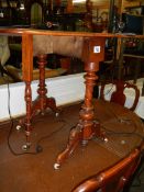 A lovely walnut drop side table (missing one caster).