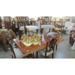 A superb quality double pedestal dining table with 6 shield back dining chairs.