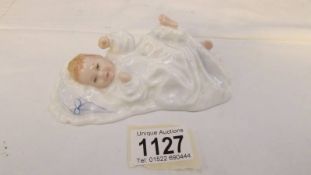 A Royal Doulton 'New Baby' figure.