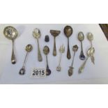 A mixed lot of silver spoons etc., 145 grams.