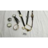 A mixed lot of vintage watches and watch heads.