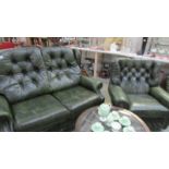A green leather 2 seat sofa and chair.