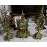 A 3 piece brass clock garniture.