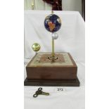 An unusual gem stone globe with moon and sun mantel clock.