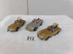 2 gold and one silver Corgi James Bond Aston Martin.