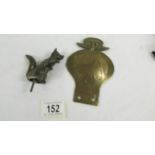 A bronzed fox car mascot and a 1930's S African AA badge.