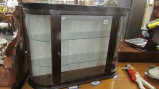A mahogany display cabinet with domed glass. ****Condition report**** Width 88cm.