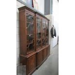 A mahogany 4 door astragal glazed book case.