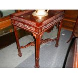 A mahogany galleried table. ****Condition report**** No missing or broken fretwork.