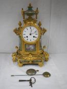 A superb quality French gilded clock with hand painted Sevres panels on all sides,