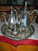 A four piece silver plate tea set.