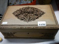 A good carved box complete with costume jewellery.