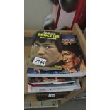 A quantity of Bruce Lee, Kung Fu and Karate books.