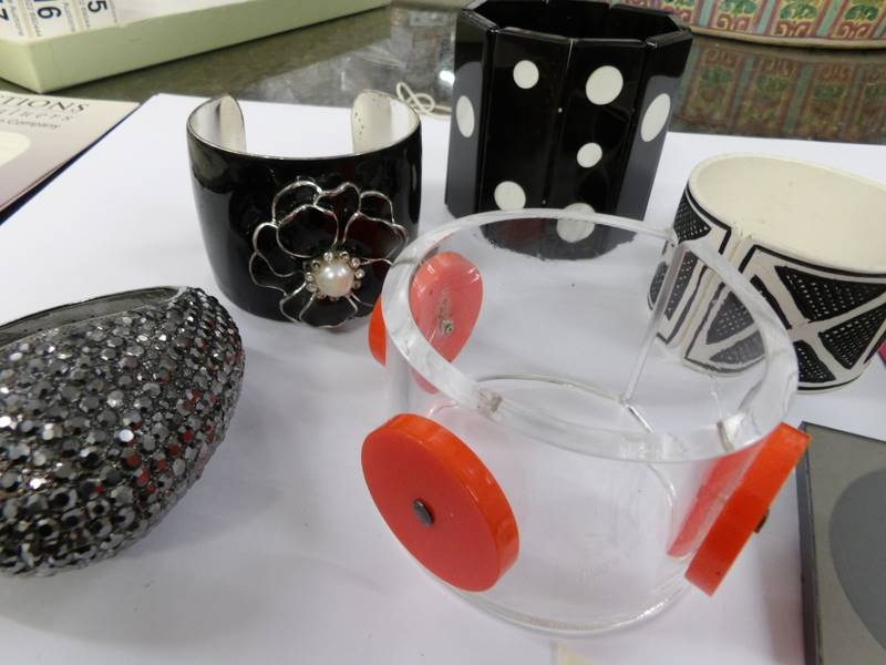 A collection of circa 1970/80's cuffs and bangles in different styles and materials together with a - Image 3 of 3