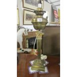 A brass Corinthian column oil lamp base converted to electric.