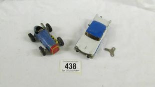 A Schuco clockwork micro racer 1045 ford and 1041 racing car.