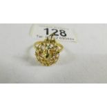 A fretwork ring, size N half, (tests a 24ct gold), 3.5 grams.