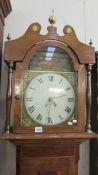 An oak cased long case clock with painted dial.