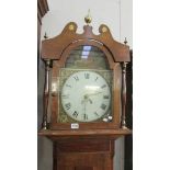 An oak cased long case clock with painted dial.