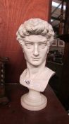 A white glazed porcelain bust.