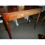 A mahogany fold over tea table.