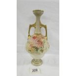 A Doulton Burslem 25.5 cm tall vase with quite small opening at top.