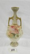 A Doulton Burslem 25.5 cm tall vase with quite small opening at top.